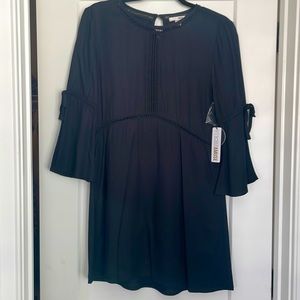 New with tags never worn black midi dress. Bell sleeve